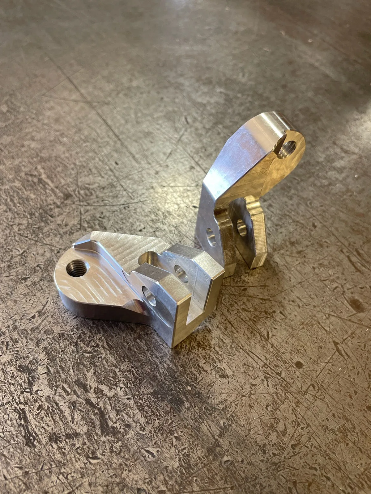 Pair of machined M8 Universal Shred Brackets, shown without footpegs